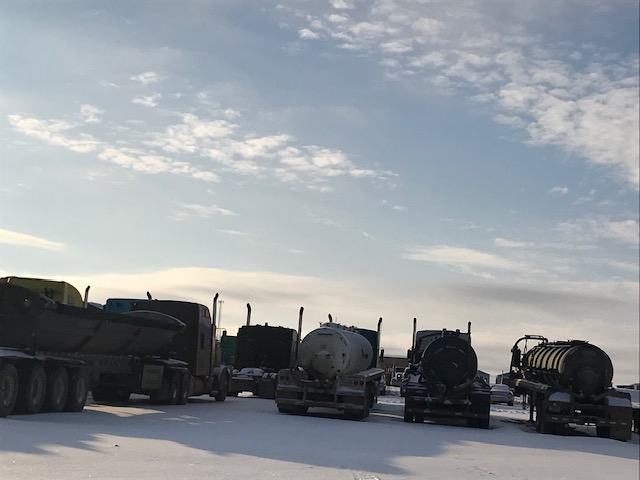 DSG Oilfield fleet of trucks lined up in the yard